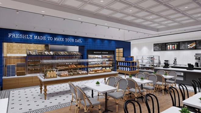 a rendering of the inside of a bakery with tables and a case filled with pastries