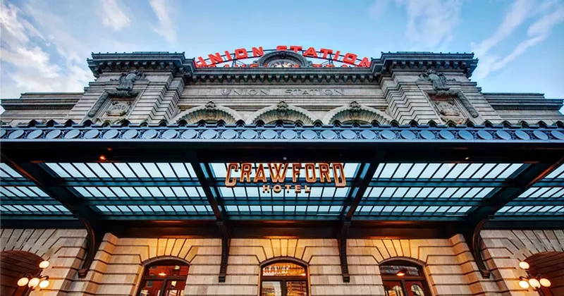 Image: entrance to train station with hotel