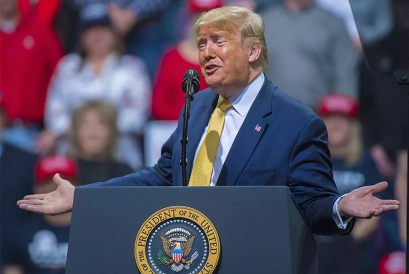 Image: donald trump at podium during rally