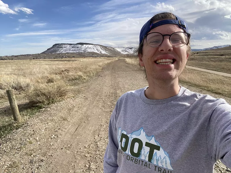 Image: Michael Tormey smiling to camera while on the Denver Orbital Trail