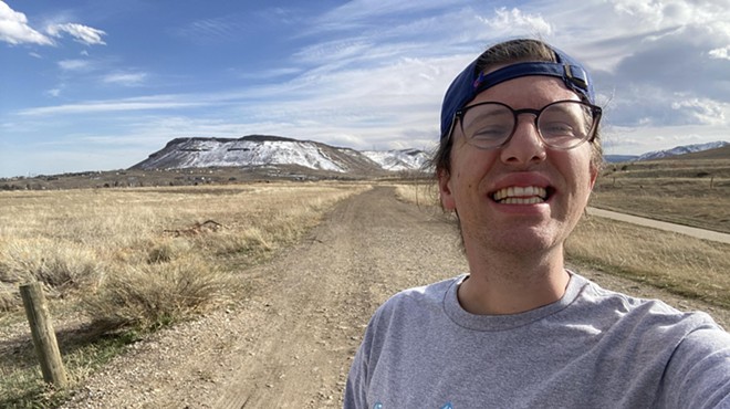 Michael Tormey smiling to camera while on the Denver Orbital Trail