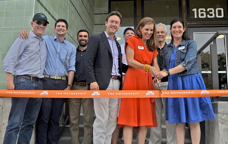 Mayor Mike Johnston and Urban Peak CEO Christina Carlson (center) were excited to open the new Mothership campus on 1630 South Acoma Street on Wednesday, July 24, even as issues with wage theft linger.