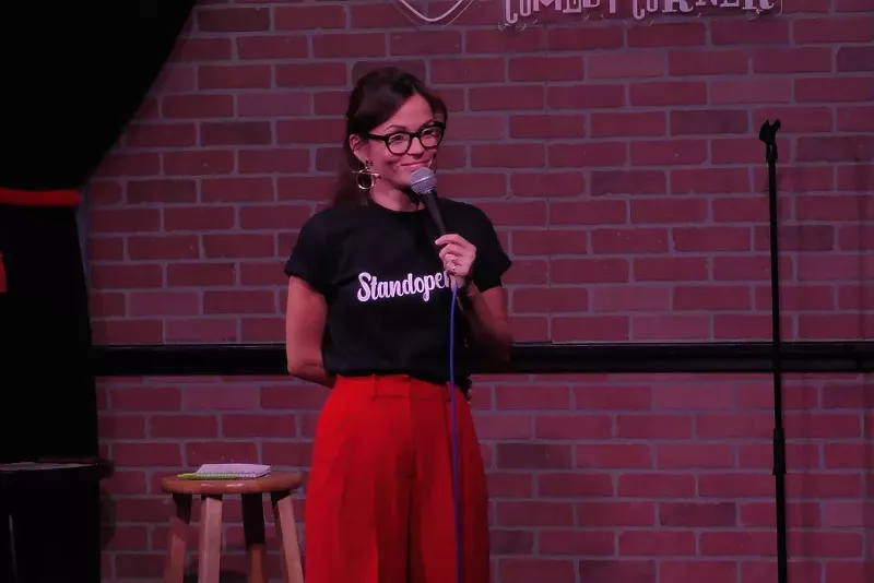 Image: A comedian performs.