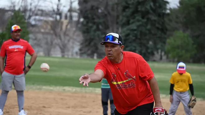 A man toss a ball.