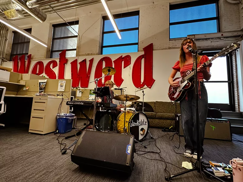 Image: band performing inside the denver westword office