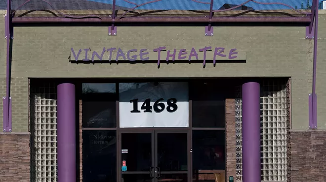 outside of building with sign reading "vintage theatre"