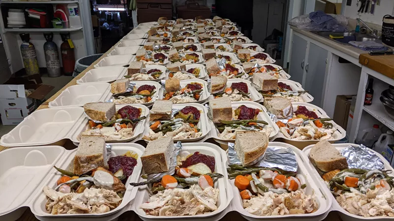 Image: to-go meals lined up on a table