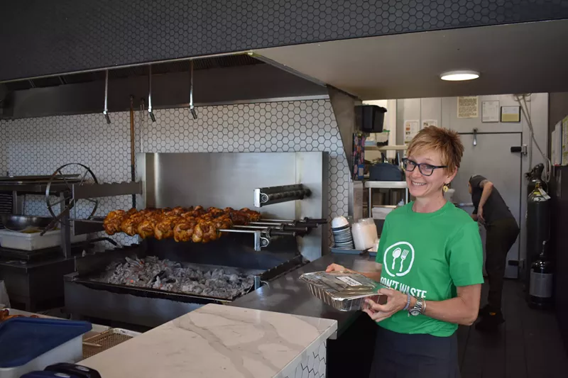 Image: A volunteer retrieves a donation from Chook Chicken.