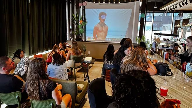 People watch Love Island on a big screen