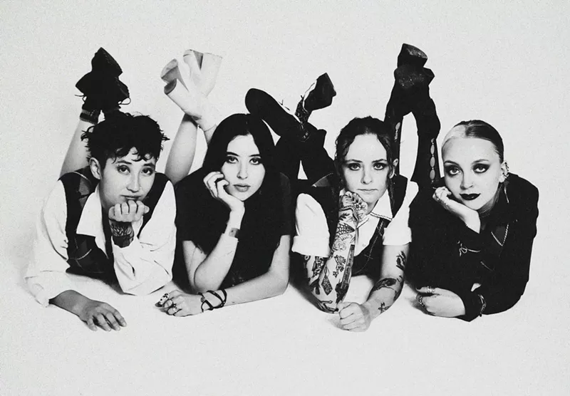 Image: four women posing on the ground