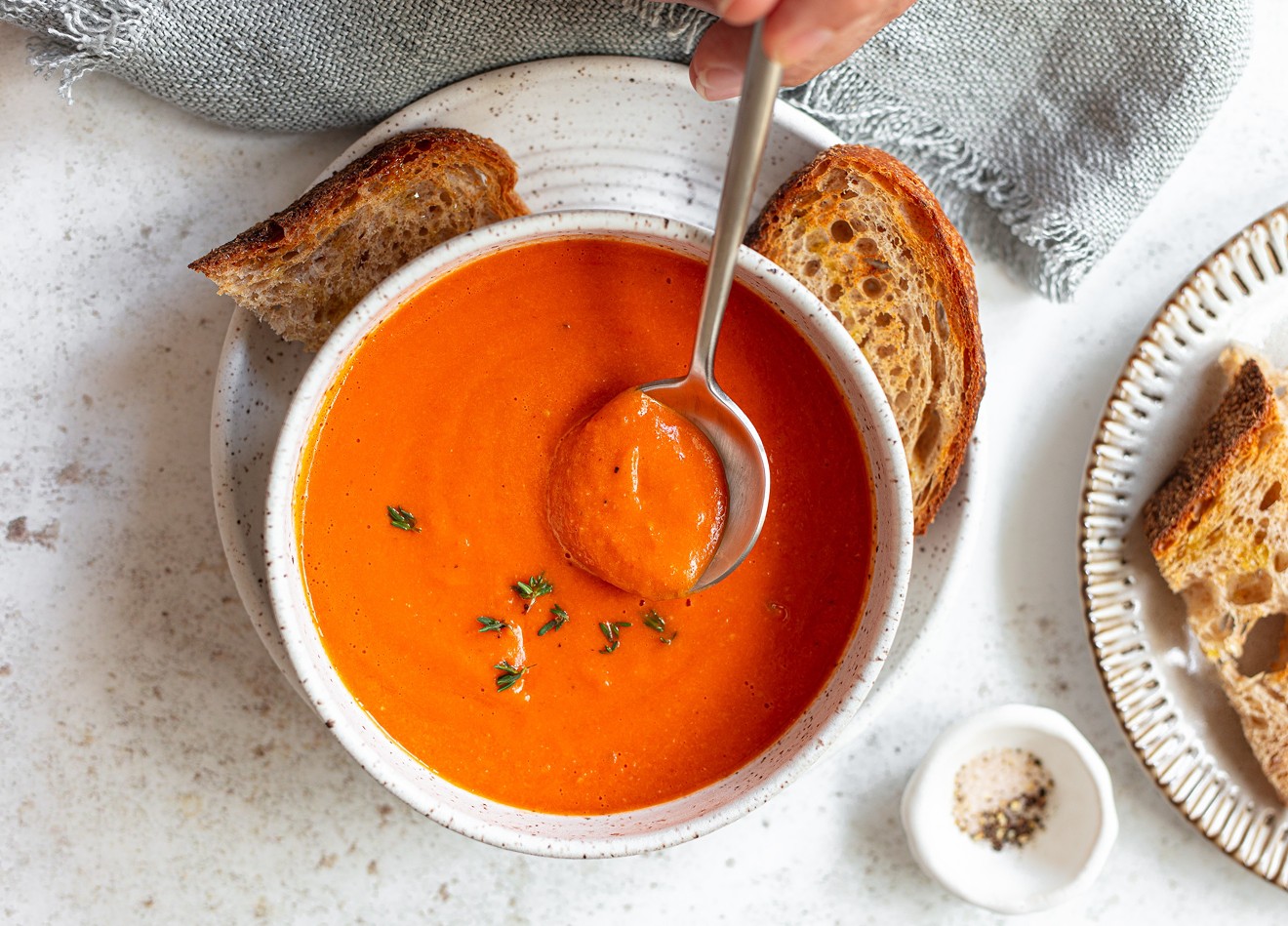 The roasted tomato soup is thickened with crusty bread instead of dairy.