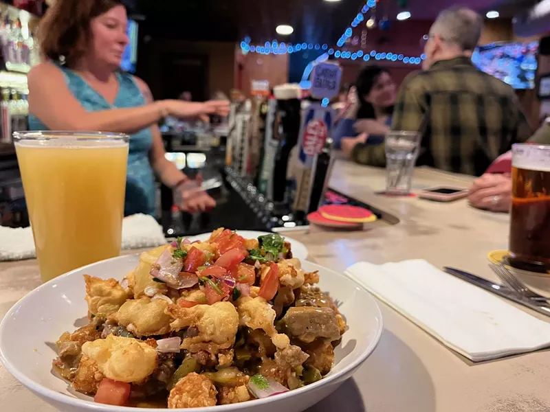 Image: fried cheese curds on top of fries