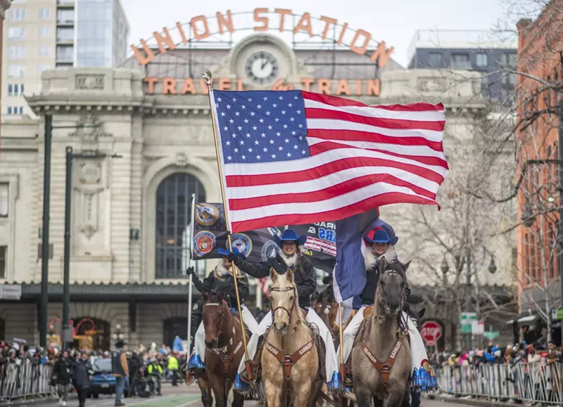 Image: flag and horses in parade