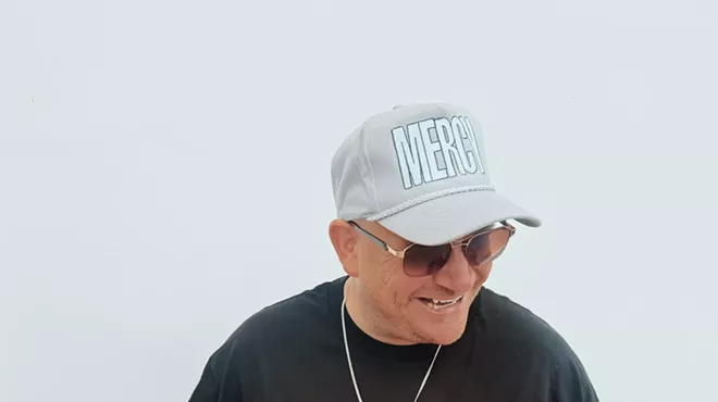 a man in a white hat