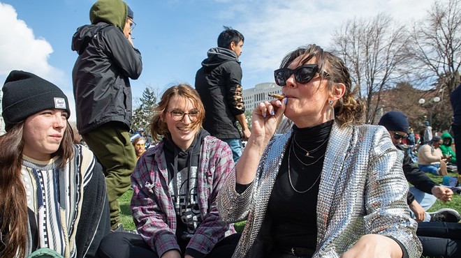 Group of women smokes marijuana at the park