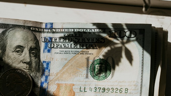 Marijuana leaf on a hundred dollar bill