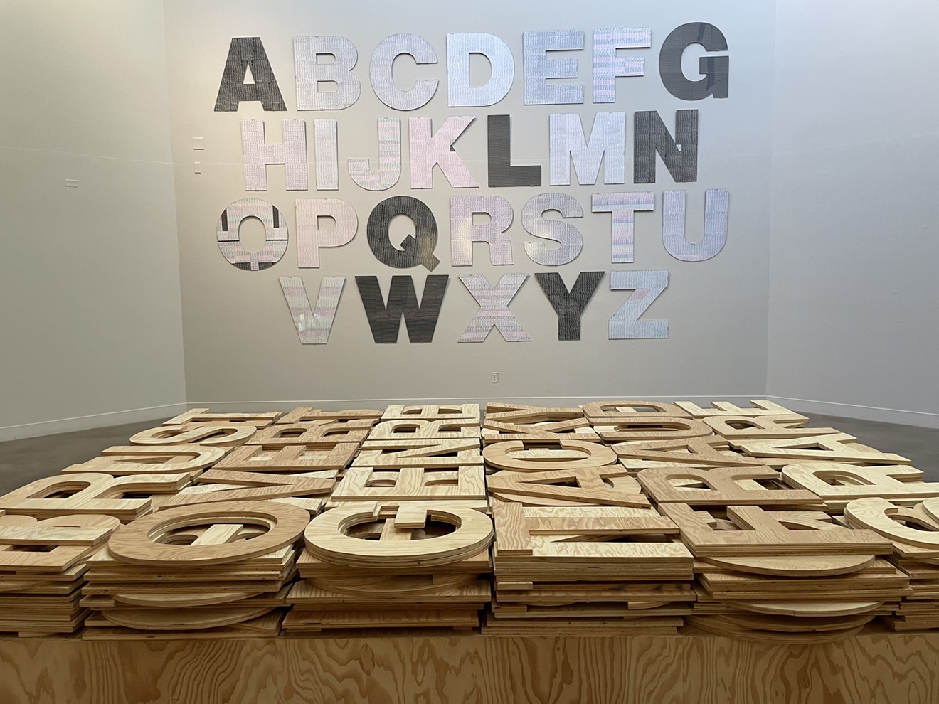 Roland Bernier’s acrylic alphabet (on the wall); “Word Works” (on the floor) at the Arvada Center.