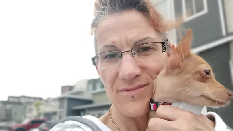 Image: The late Amy Cross and a friend, as seen in a photo from her online obituary.