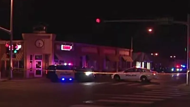 Image: Aurora police on the scene of the latest shooting early on November 28.