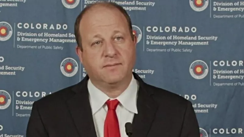 Image: Governor Jared Polis considers a question during a November 19 press conference about COVID-19.
