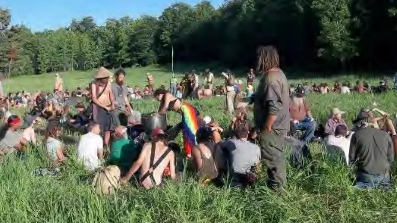 Image: A photo of a past Rainbow Family gathering shared by the U.S. Forest Service in a presentation about planning for the 2022 event.