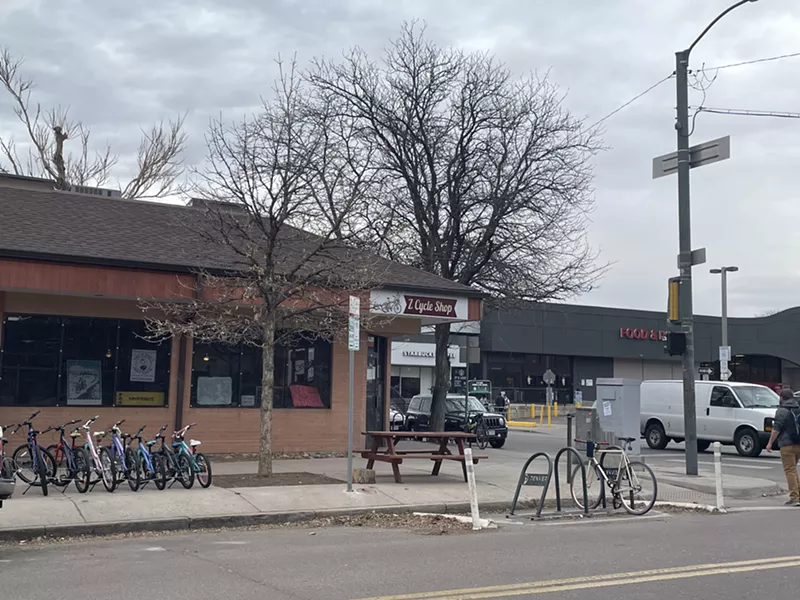 Image: A brown brick one-story building.